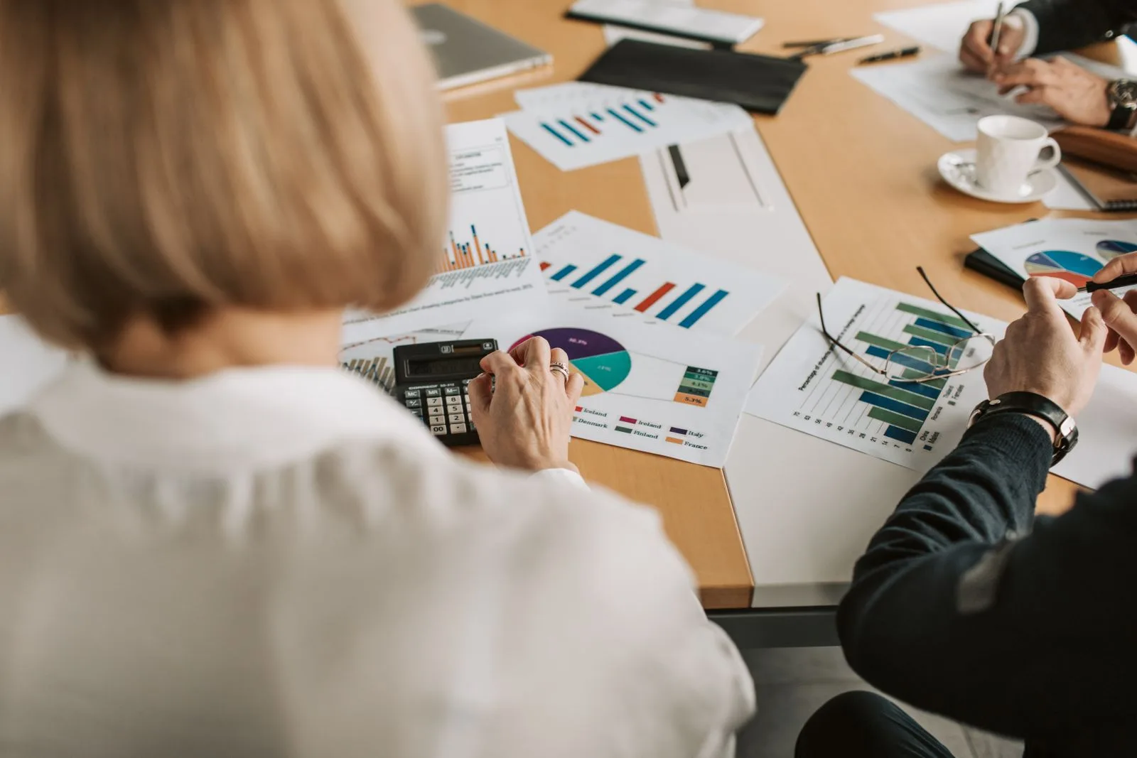 Marketing professionals discussing campaign strategy and performance metrics