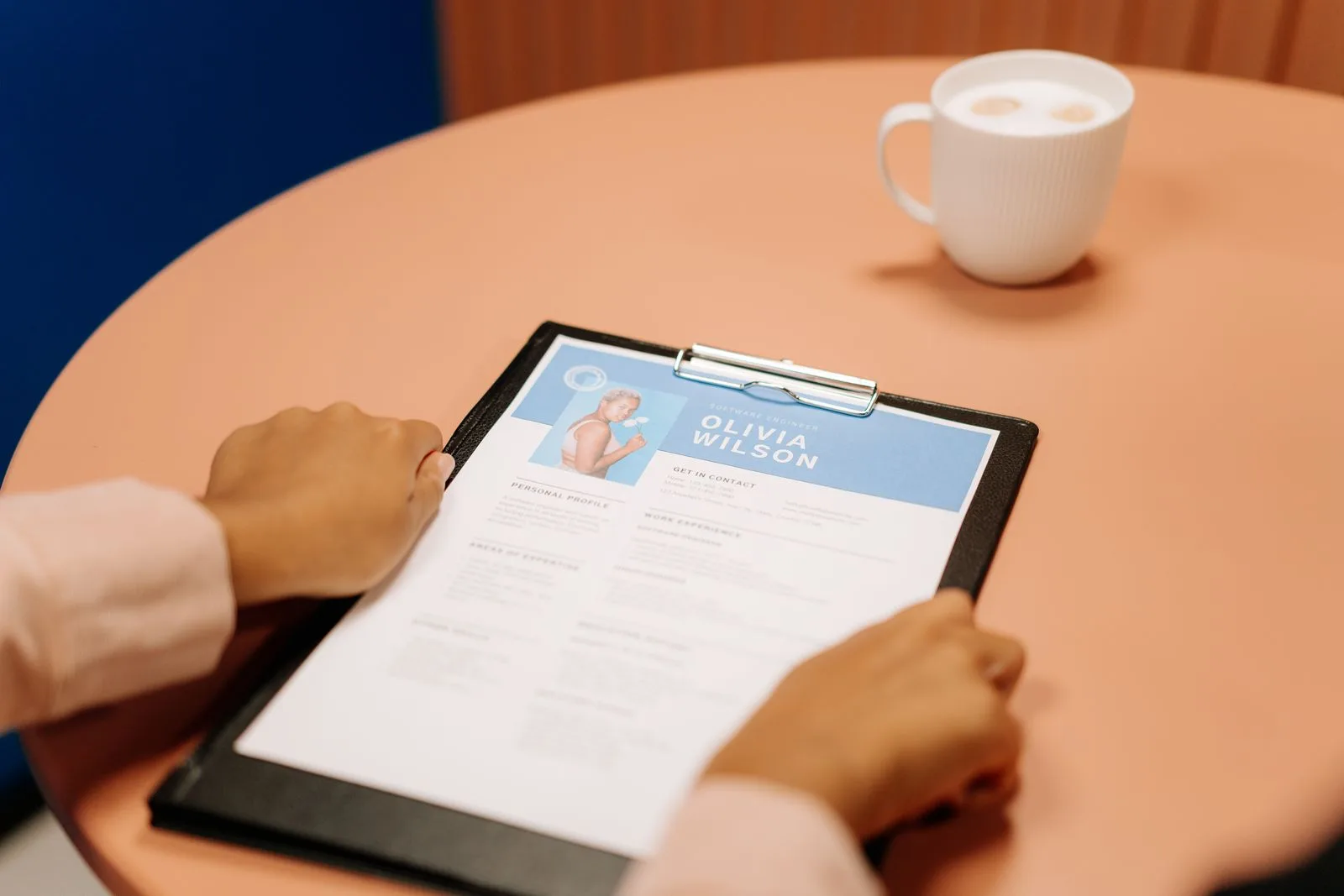 Professional carefully reviewing a candidate's resume document