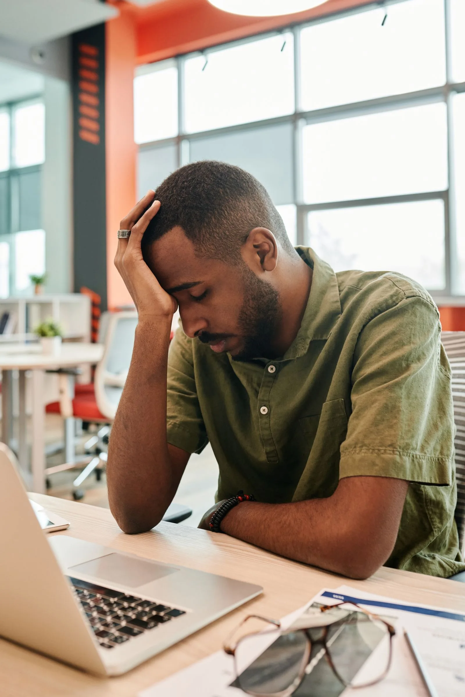 Recruiter appearing tired and overwhelmed after reviewing missed interview appointments