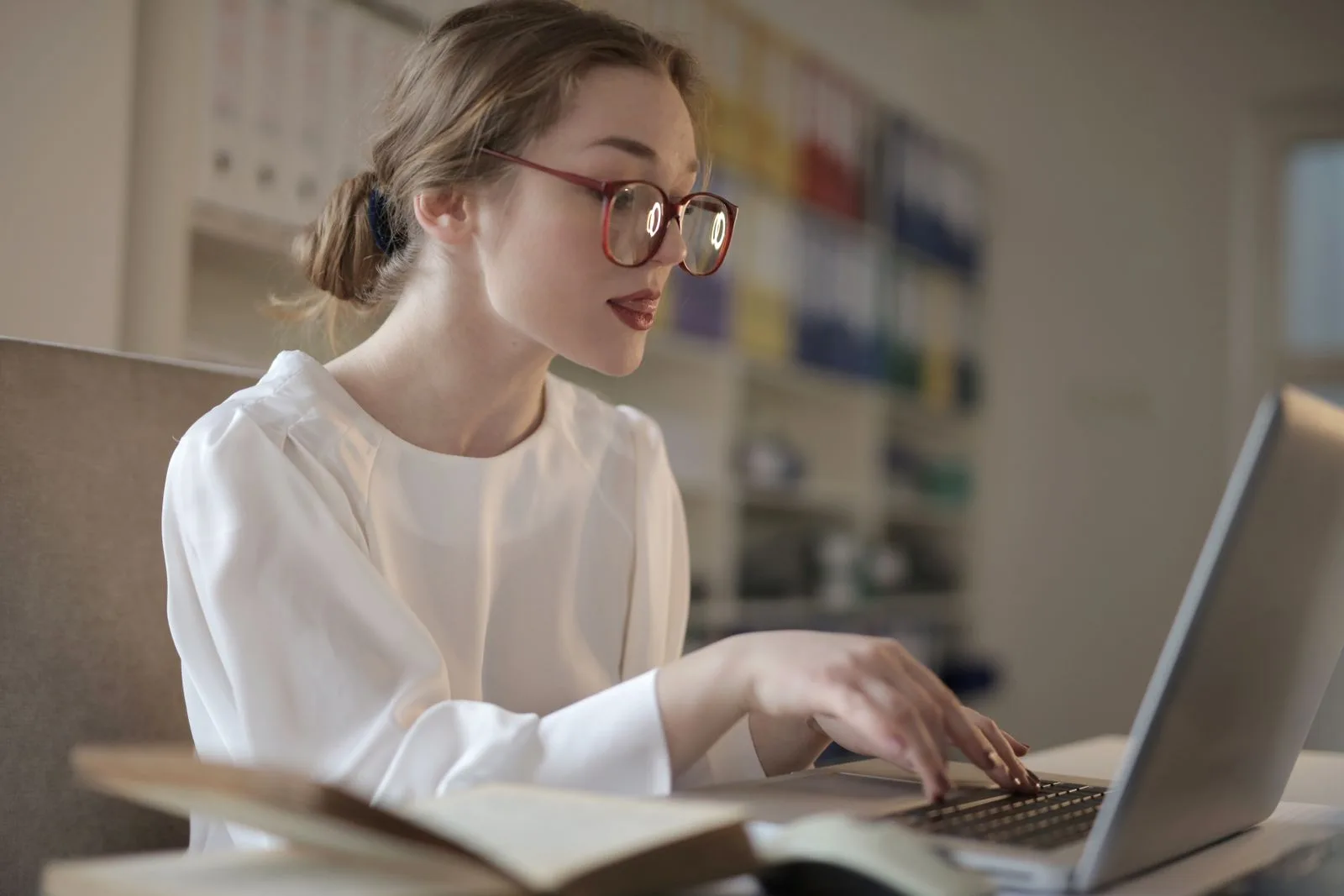 Professional researching job opportunities on laptop computer
