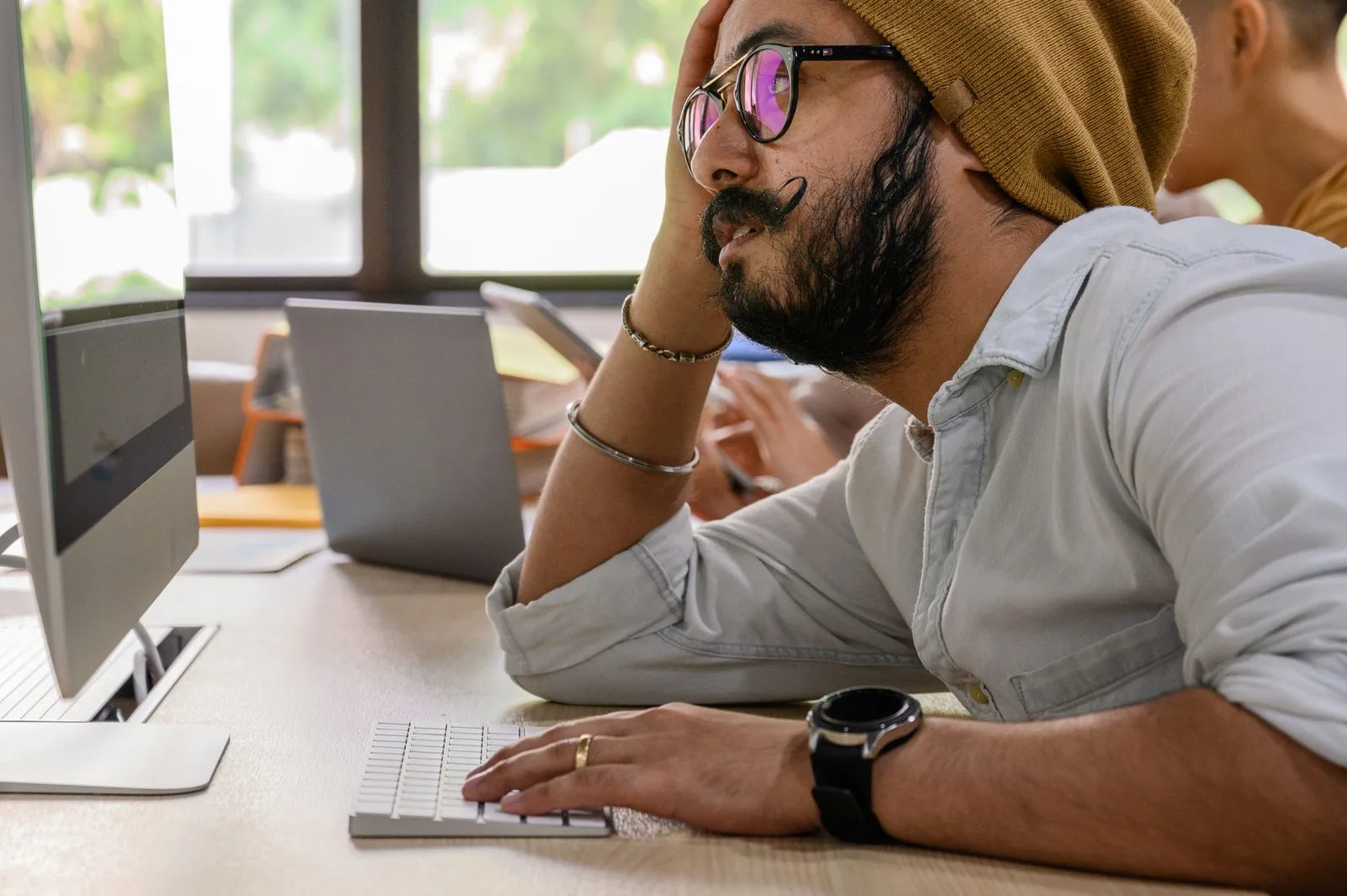 Person at laptop reviewing a draft cover letter before sending an application