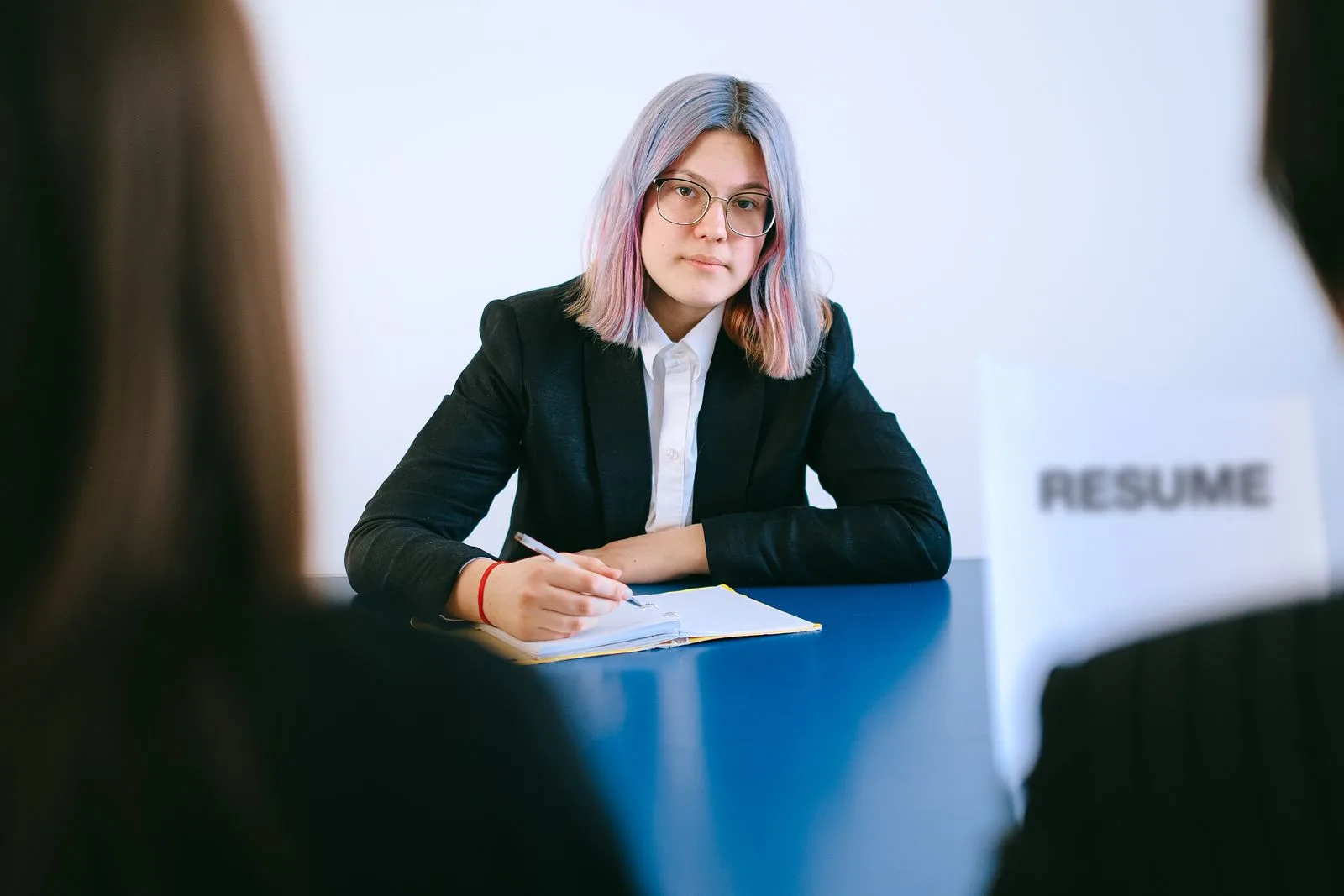 A professional preparing for a job interview with career documentation