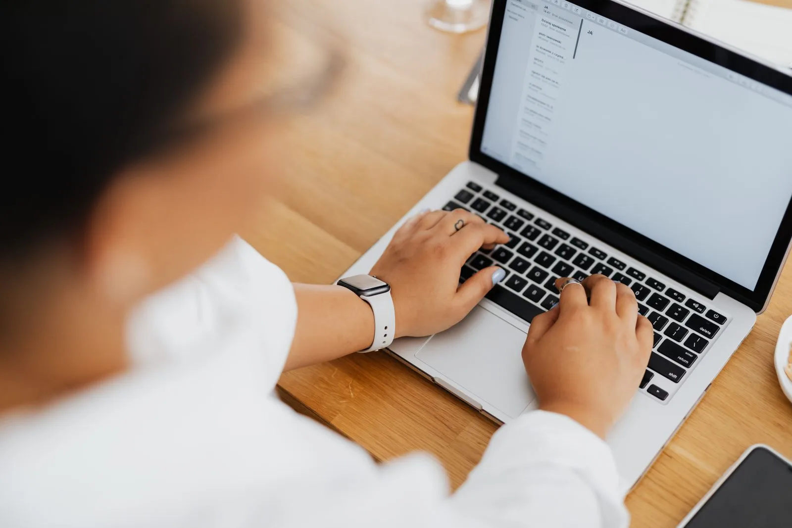 Professional composing a follow-up email message on their computer