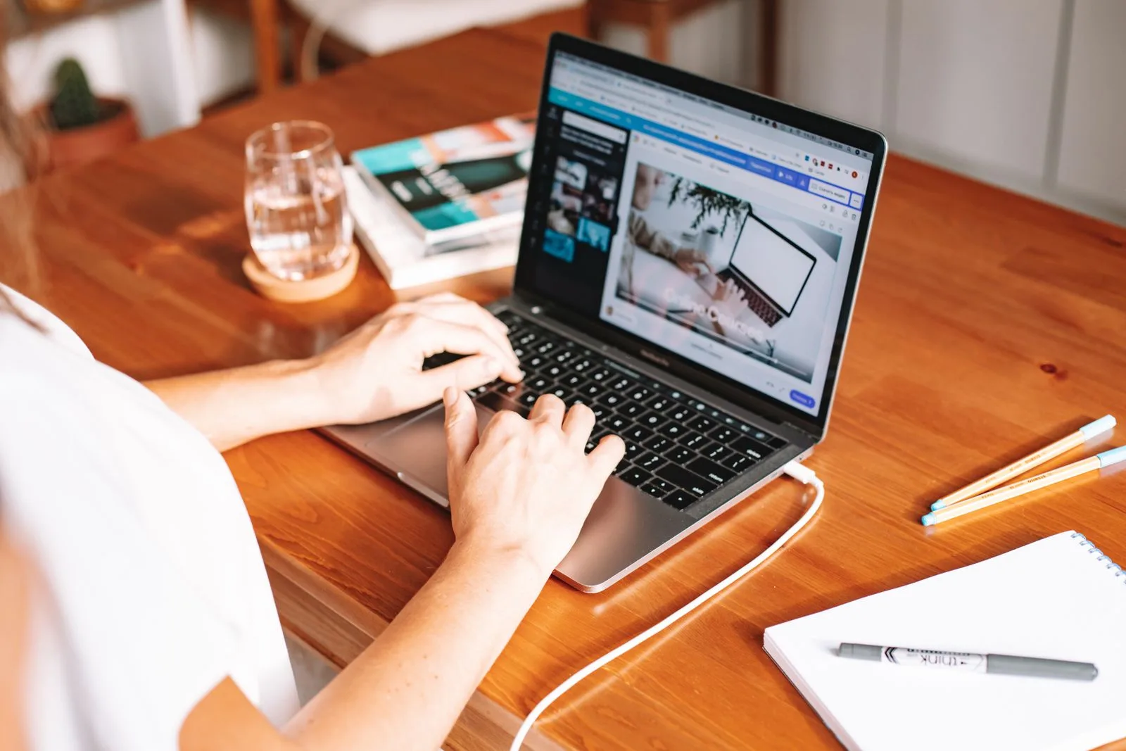 Person focused on laptop during concentrated job search work session