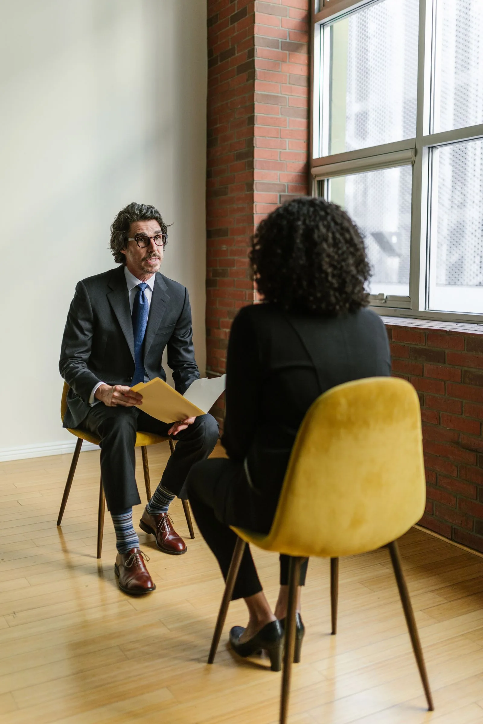 Professional recruiter conducting candidate interview in modern office setting