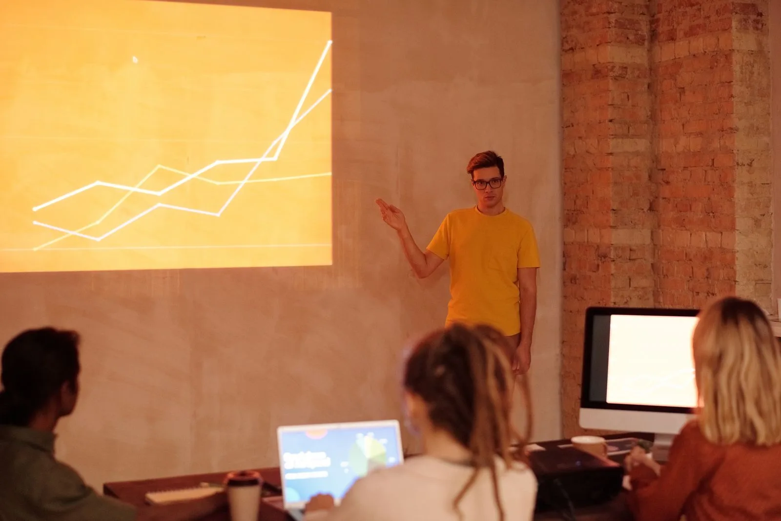 Professional presenting work achievements and accomplishments to team