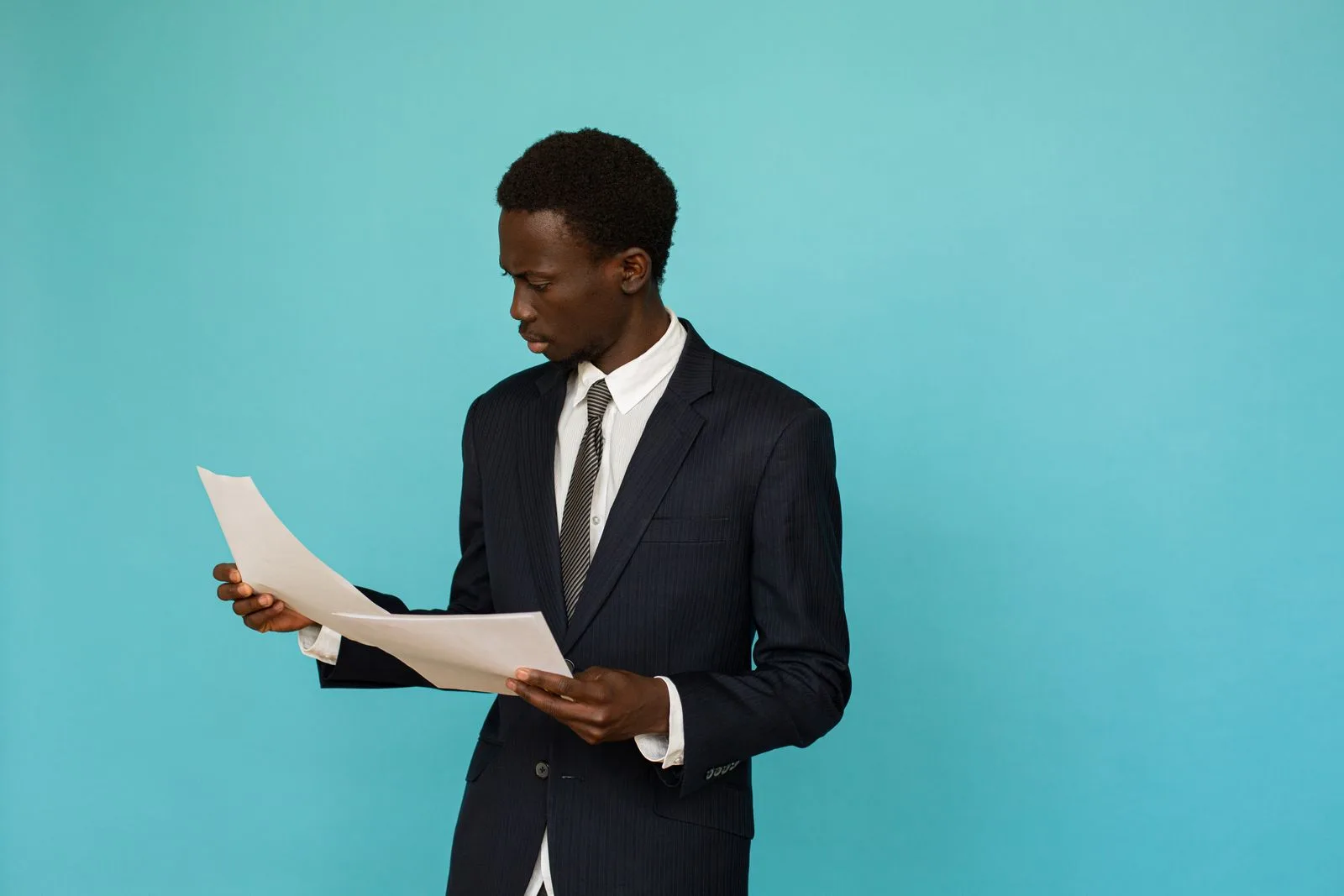 Job seeker carefully reviewing a job posting on their computer