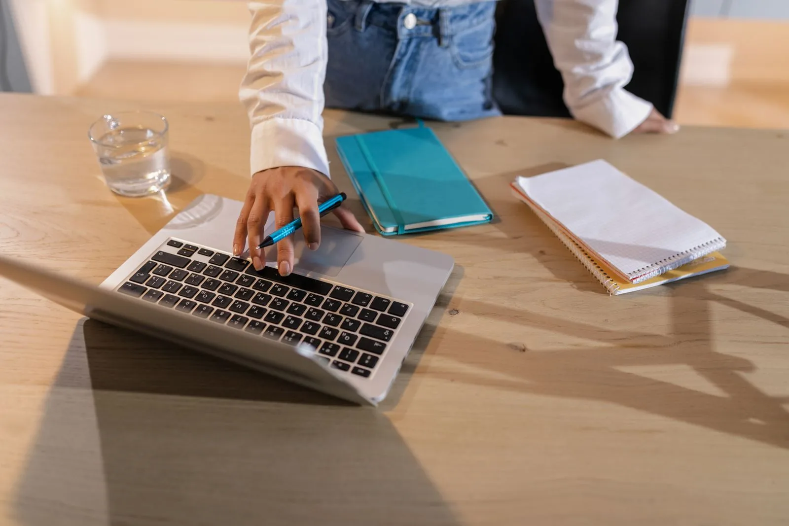 Person researching recruiter and company information on their laptop