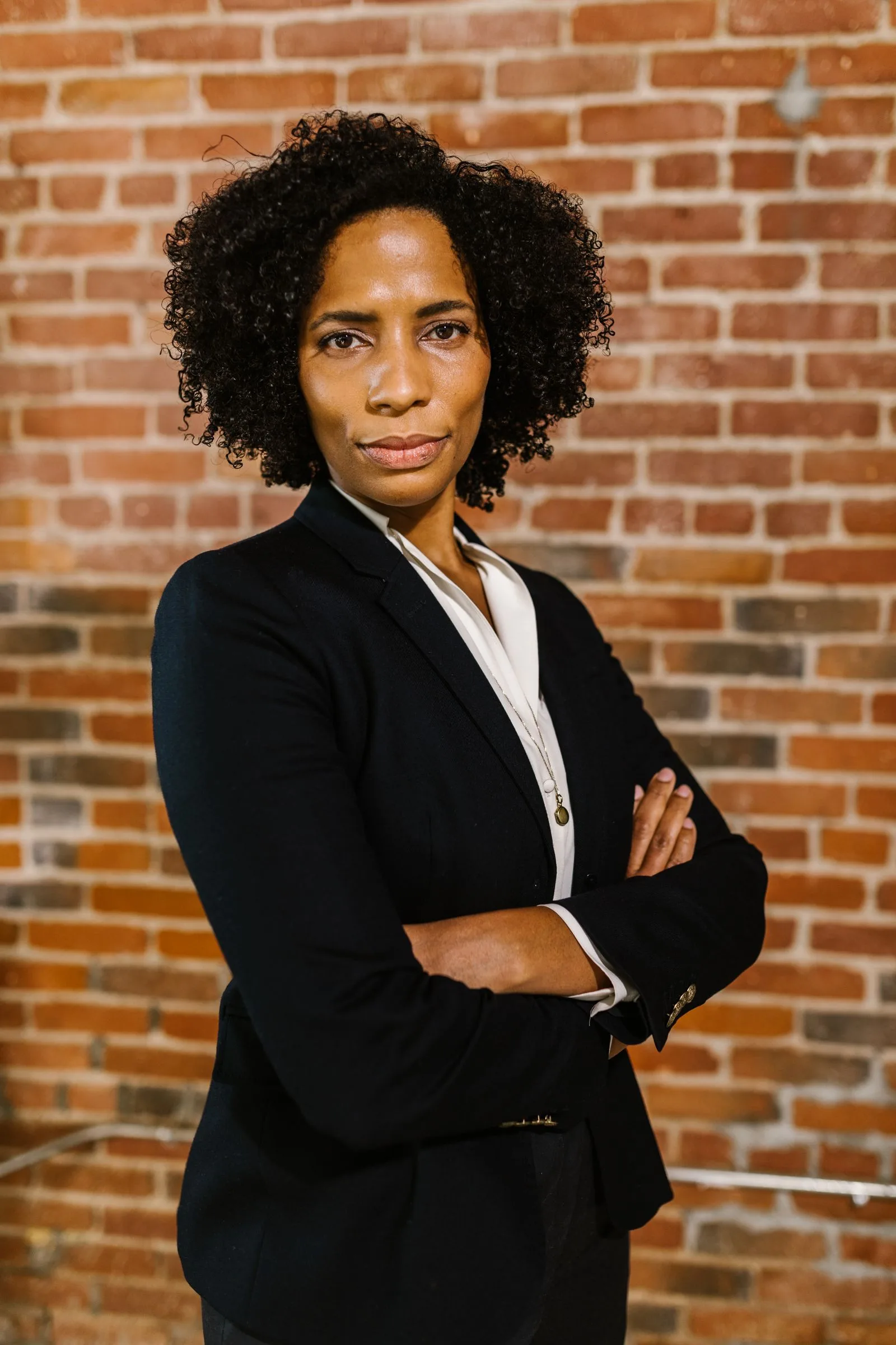Professional woman posing for a business headshot portrait