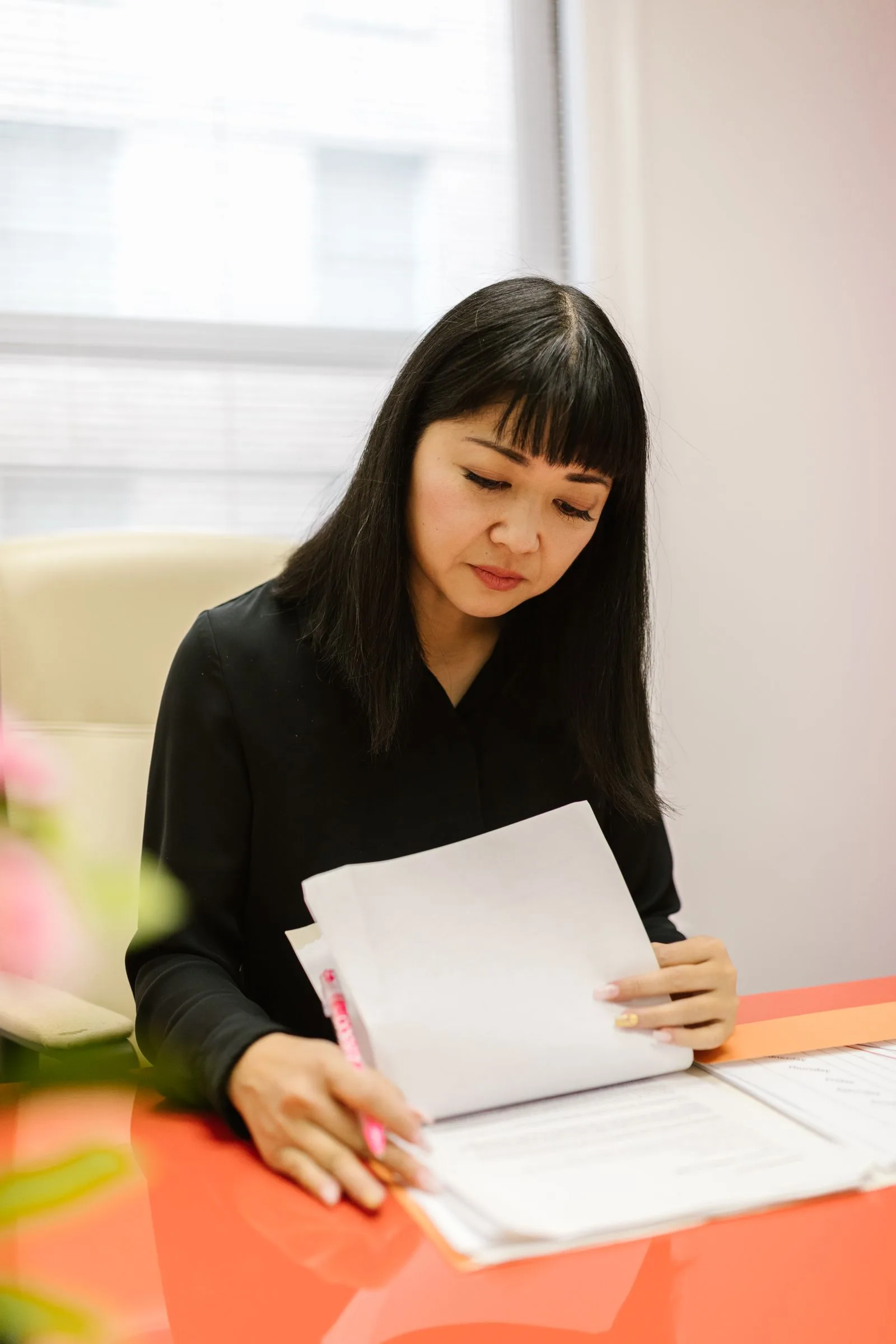Person carefully reading and analyzing a job posting document