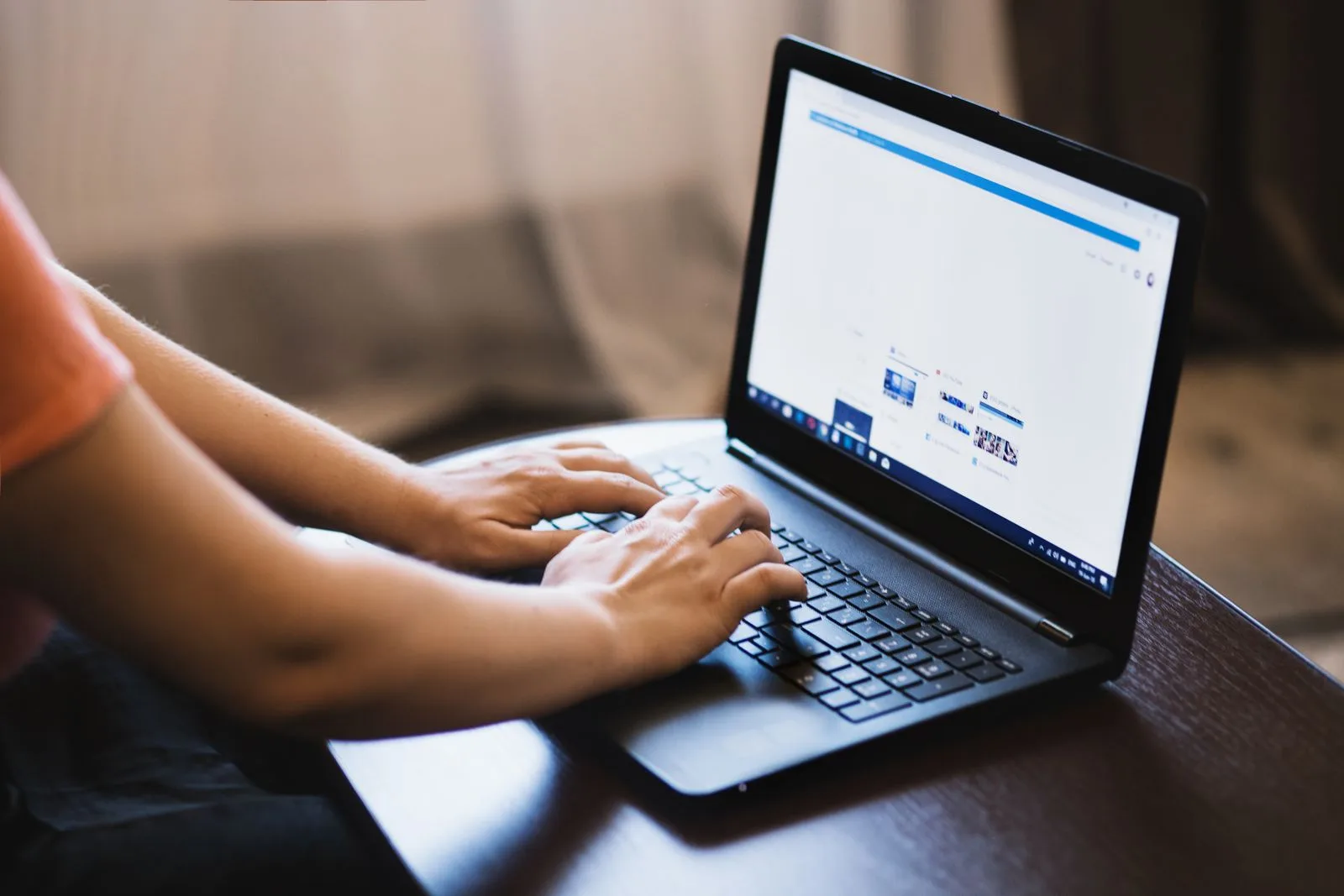 Person at laptop viewing job listing with blank salary field