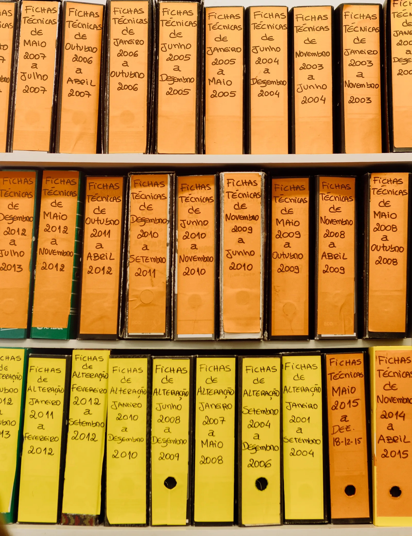 Organized office files containing professional records and achievements